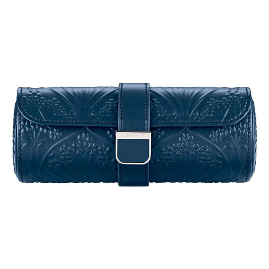 Elevate your style with the WOLF 1834 X Liberty All Over Ianthe Triple Watch Roll Navy—a sophisticated navy leather accessory adorned with embossed floral patterns, a convenient strap, and a silver rectangular clasp engraved with “LIBERTY.” Perfect for pairing with your favorite travel watch storage or leather watch case from WOLF.