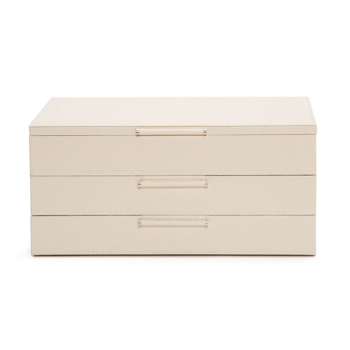 The WOLF 1834 Jewellery Box with Drawers by WOLF is a beige, rectangular piece featuring three stacked compartments, each adorned with a sleek horizontal metal handle. Made from sustainable leather, it showcases a minimalist design and includes an anti-tarnish lining, all set against a plain white background.