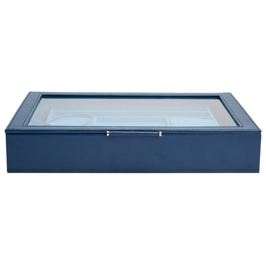 Introducing the WOLF 1834 Sophia Jewellery Box with Window by WOLF. This rectangular jewelry box, crafted from blue leather, boasts a transparent glass lid and features a LusterLoc™ anti-tarnish lining. Its elegant design is further enhanced by gold-accented hinges, ensuring both style and protection for your cherished items.