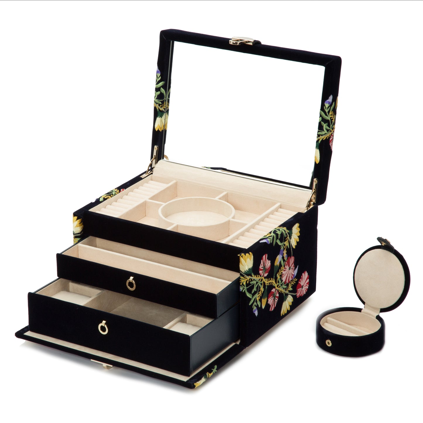 The WOLF 1834 Zoe Medium Jewellery Box in black showcases elegant floral patterns and opens to reveal multiple compartments lined with light beige anti-tarnish fabric, including slots, drawers, and a circular section for organized storage. It also comes with a separate small circular jewellery case for optimal organization.