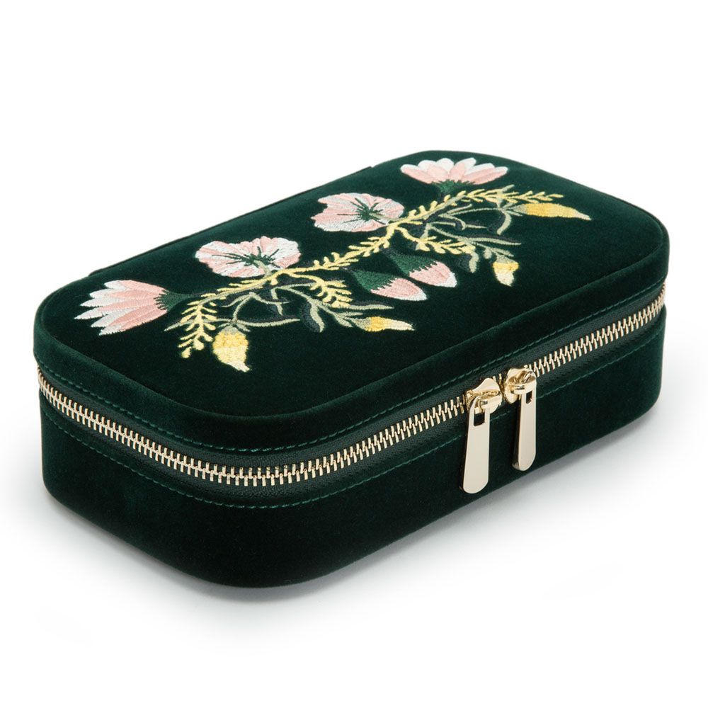 Introducing the WOLF 1834 Zoe Travel Zip Case in Forest Green: this elegant travel jewelry organizer by WOLF is crafted in dark green velvet with a gold zipper and features pink and yellow embroidered flowers on the lid. Its luxurious LusterLoc lining helps keep your treasures tarnish-free wherever you go.