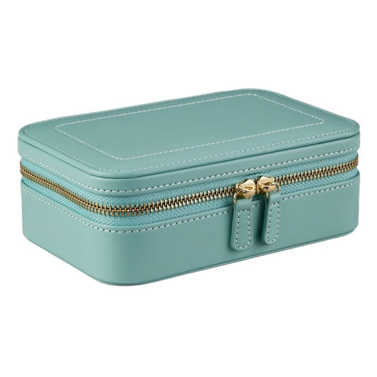 A rectangular, jade-green WOLF 1834 X Fiona Howard Sophia Travel Zip Case featuring botanical-inspired quilting, crisp white stitching, gold double zipper, and softly rounded corners, is crafted from premium leather and shown closed against a white background.
