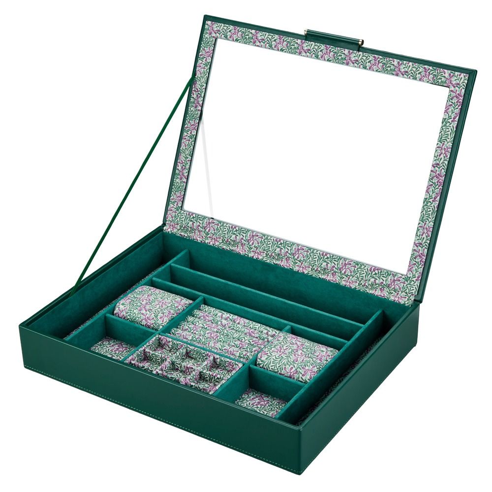 WOLF 1834 X Fiona Howard Botanical Jewellery Box With Window by WOLF, shown open to reveal multiple compartments lined with a green, pink, and white floral anti-tarnish fabric. Some sections feature ring slots, while others are empty. The box has a glass lid for easy viewing of your collection.
