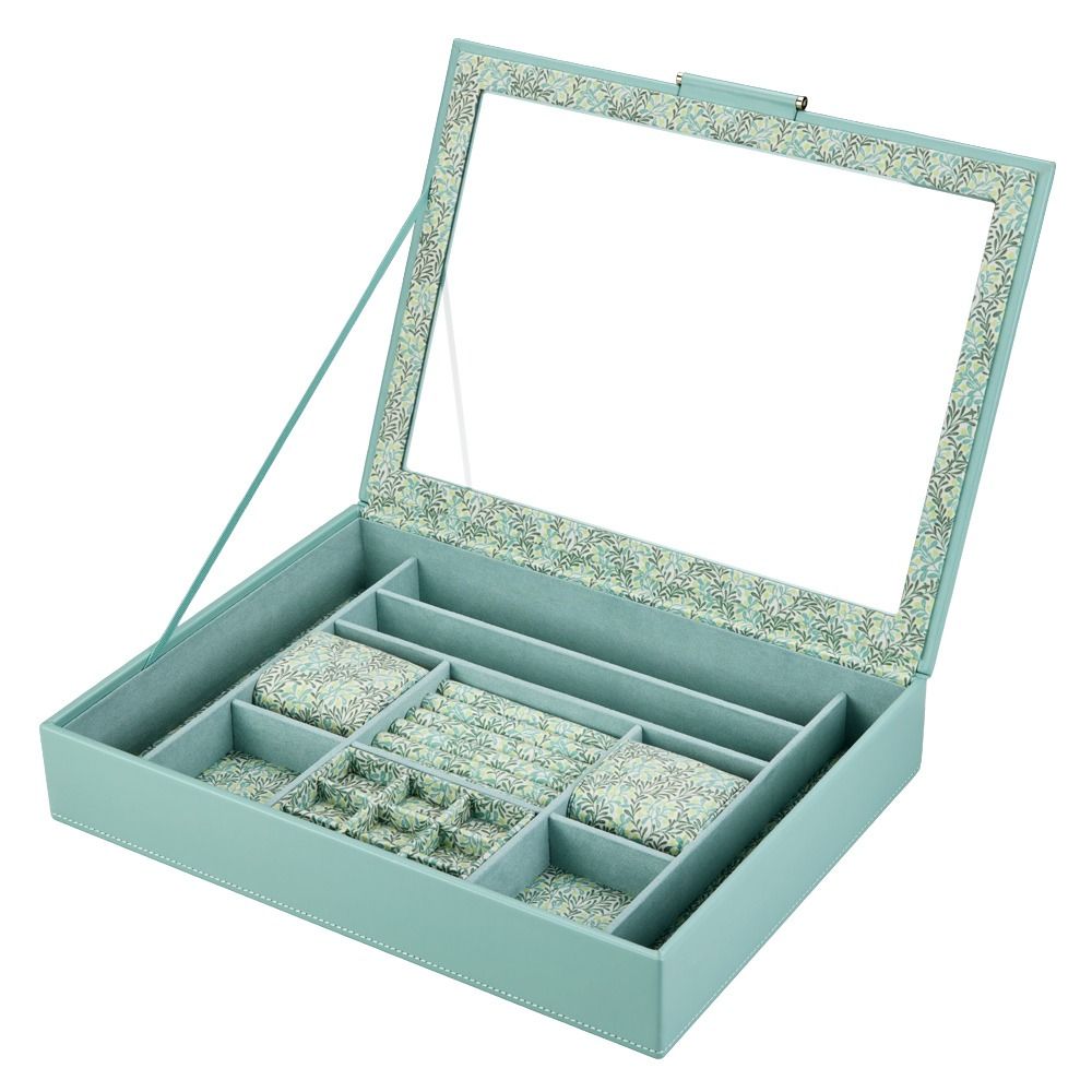 The WOLF 1834 X Fiona Howard Botanical Jewellery Box With Window by WOLF showcases a light blue design with an open lid, highlighted by a floral-patterned trim and an interior mirror. It offers multiple compartments for organizing your jewelry and features an anti-tarnish lining to keep your treasures shining.