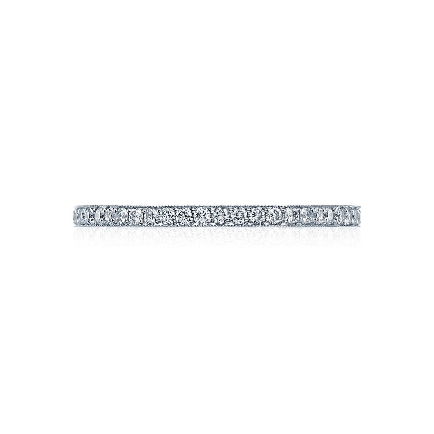 The Tacori Sculpted Crescent Platinum Round Brilliant Pavé Diamond Eternity Ring features a slim, elegant band adorned with a continuous line of small, sparkling diamonds. Perfect for engagement rings, this exquisite piece by Tacori is beautifully showcased on a white background when viewed from the side.