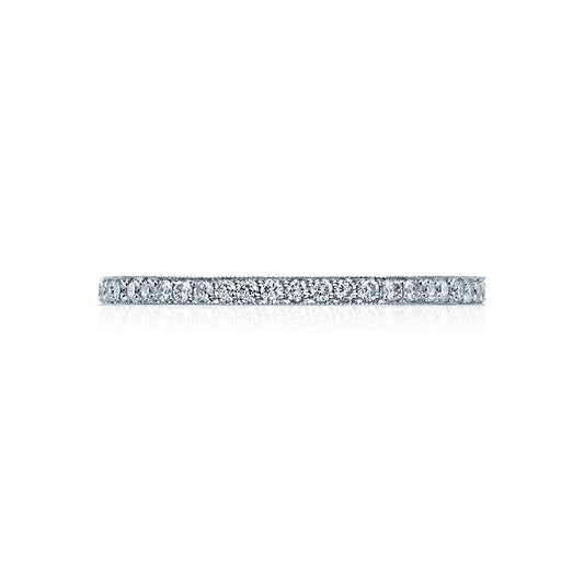 The Tacori Sculpted Crescent Platinum Round Brilliant Pavé Diamond Eternity Ring features a slim, elegant band adorned with a continuous line of small, sparkling diamonds. Perfect for engagement rings, this exquisite piece by Tacori is beautifully showcased on a white background when viewed from the side.