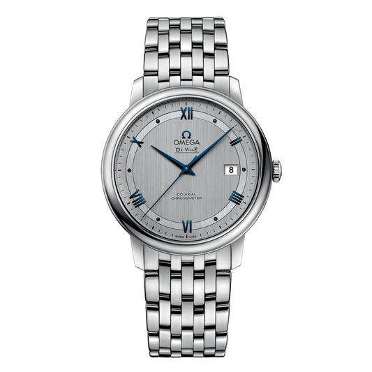 The OMEGA De Ville Prestige Co-Axial Chronometer 39.5mm Watch by OMEGA is a luxurious timepiece, offering simple elegance with its silver case and stainless steel bracelet, grey dial with Roman numerals, date window at 3 o'clock, and the precision of the Co-Axial calibre 2500 movement.
