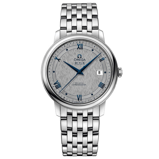 The OMEGA De Ville Prestige Co-Axial Chronometer 39.5mm Watch features a Co-Axial Calibre 2500 movement and is equipped with a stainless steel bracelet. It has a round face adorned with blue Roman numerals, a date window at the 3 o'clock position, and a textured dial with the OMEGA logo below the 12 o'clock mark.