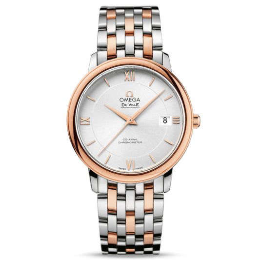 The OMEGA De Ville Prestige Co-Axial Chronometer 36.8mm Watch is a luxury timepiece with a two-tone metal strap featuring rose gold and silver links. It showcases a round silver dial adorned with Roman numerals, a date display, and the "OMEGA De Ville Prestige" branding. Complemented by a rose gold bezel, this watch features a minimalist design and is powered by the Co-Axial calibre 2500 movement.
