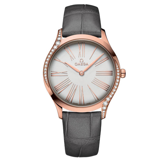 Introducing the OMEGA De Ville Trésor Quartz 36mm Watch, an elegant wristwatch with a white face adorned with Roman numerals and a rose gold casing, enhanced by diamond pavé. This exquisite timepiece features an 18K Sedna™ gold finish and a crocodile-patterned gray leather strap, while the prestigious "OMEGA" brand name is prominently displayed on the watch face.