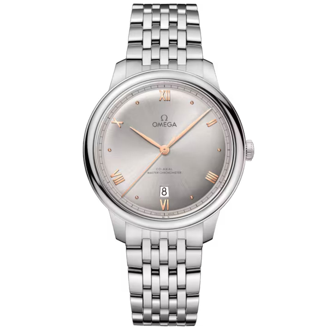 The OMEGA De Ville Prestige Co-Axial Master Chronometer 40mm features a round silver dial, rose gold Roman numerals, date window at 6 o’clock, and a stainless steel bracelet—offering timeless elegance by OMEGA.