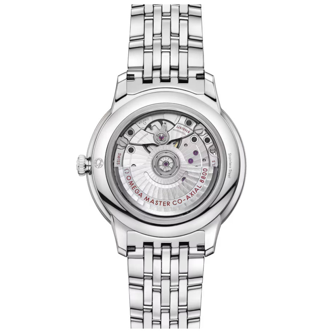 The OMEGA De Ville Prestige Co-Axial Master Chronometer 40mm Watch features a stainless steel case, transparent back showcasing the OMEGA MASTER CO-AXIAL 8800 movement, metal bracelet, and engraved detailing in line with the collection’s refined style.