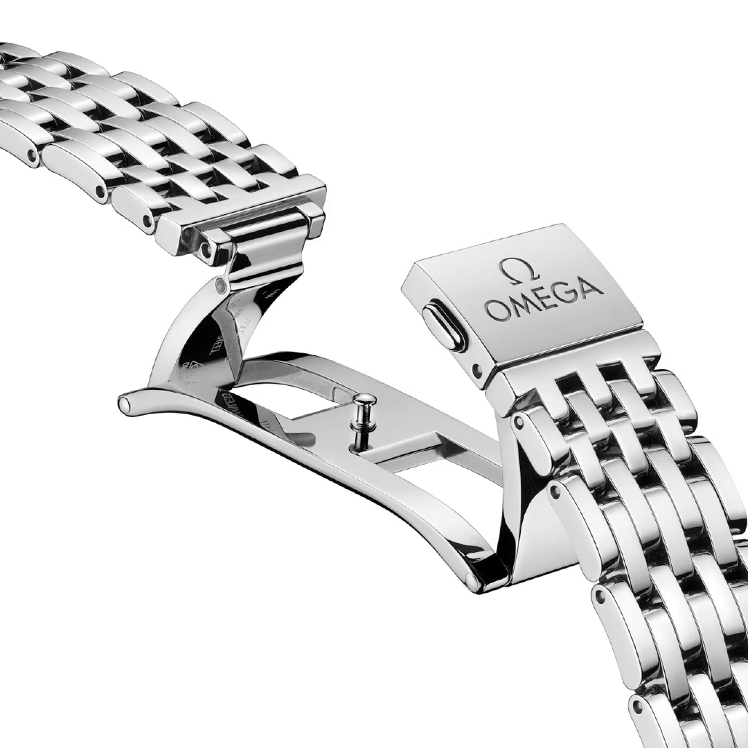 Close-up of a silver metal watch band with a folding clasp, showcasing the brand name "OMEGA" and its logo engraved on the clasp. This stainless steel model highlights an elegant and intricate link design, reflecting the sophistication of the OMEGA De Ville Prestige Co-Axial Master Chronometer Small Seconds 41mm Watch collection.