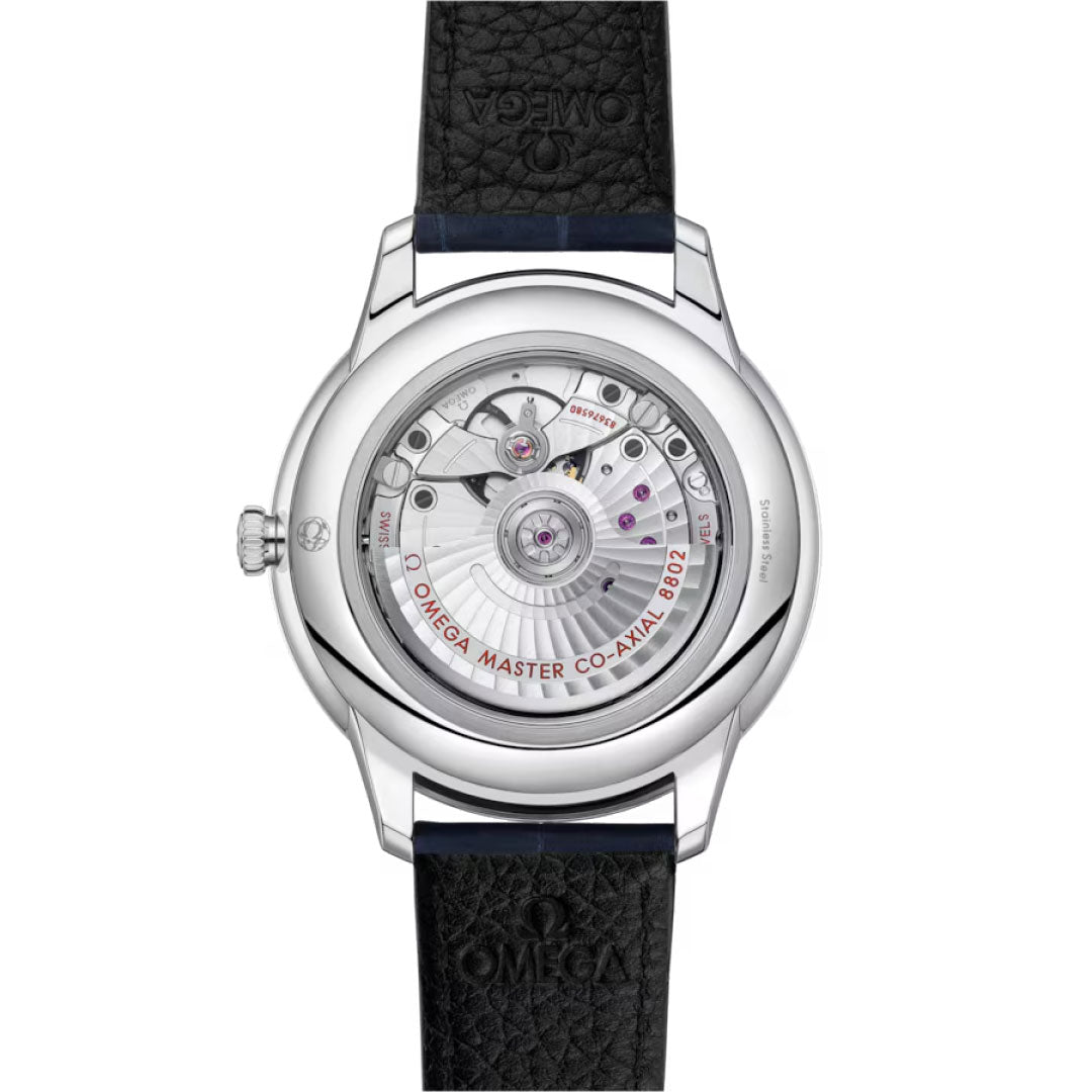 The back view of the OMEGA De Ville Prestige Co-Axial Master Chronometer Small Seconds 41mm watch shows its black textured strap, transparent case back, and the detailed "OMEGA MASTER CO-AXIAL 8902" movement inside.