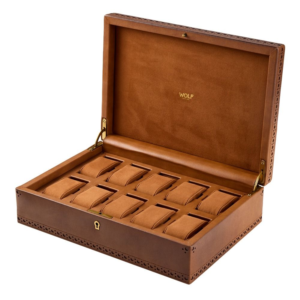The WOLF 1834 Brogue 10 Piece Watch Box in Burnished Brown is an open vegan leather case featuring a suede interior, ten individual watch compartments, and a hinged lid—ideal for stylish, organized watch storage. The word “WOLF” is embossed inside the lid.