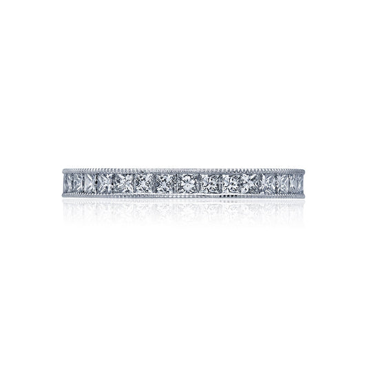 The Tacori Sculpted Crescent 18K White Gold Channel Set Round Brilliant Diamond Eternity Ring exudes an elegant and classic charm, featuring a band of small, round-cut diamonds set all the way around. With intricate milgrain detailing along the edges and a dazzling diamond ceiling, this stunning piece from Tacori is truly captivating.
