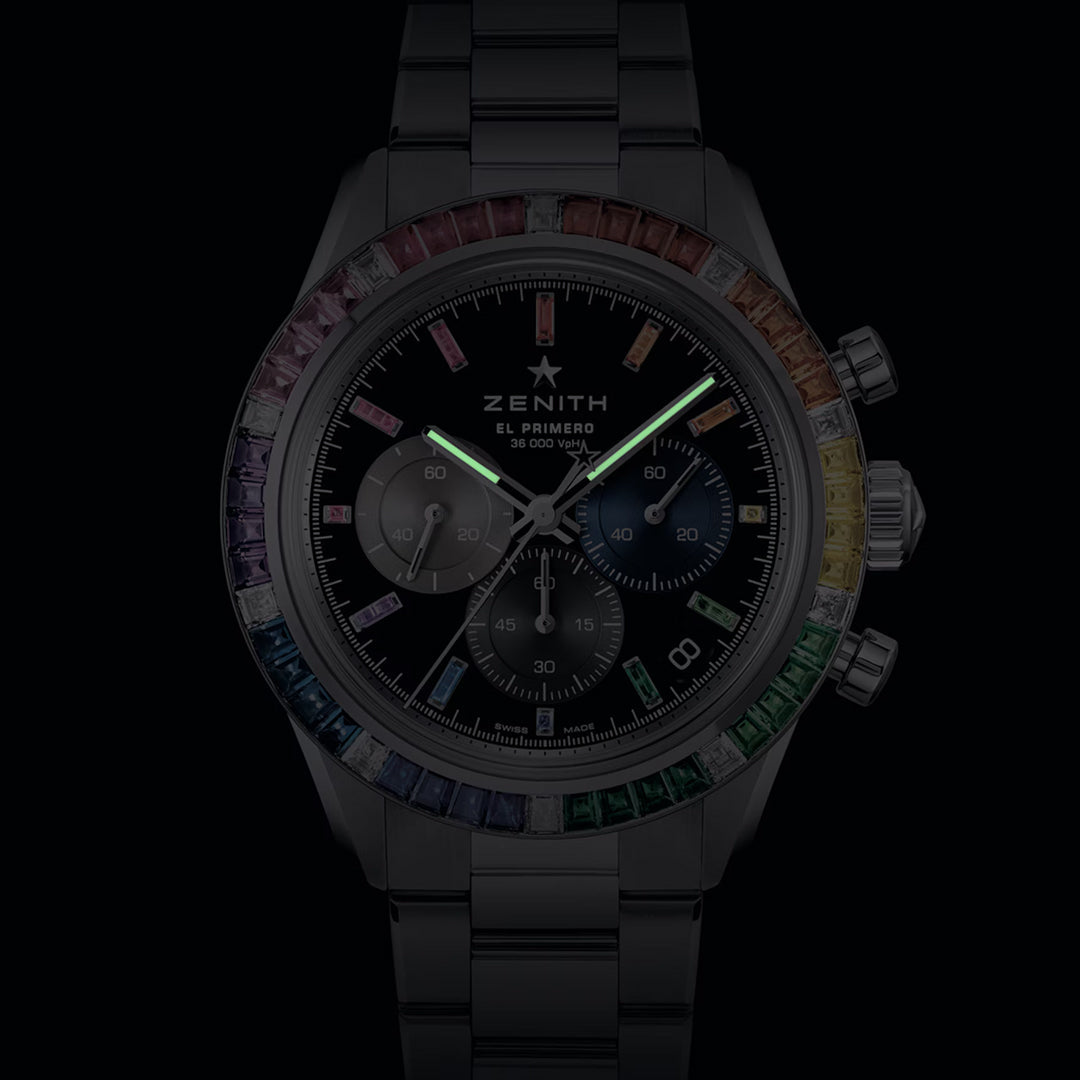 The Zenith Chronomaster Sport El Primero 3600 41mm Watch features a dark face, luminescent hands, and a rainbow sapphire bezel. Minimal numbers and a sleek design enhance its metallic strap, driven by the El Primero 3600 movement for precise timekeeping.