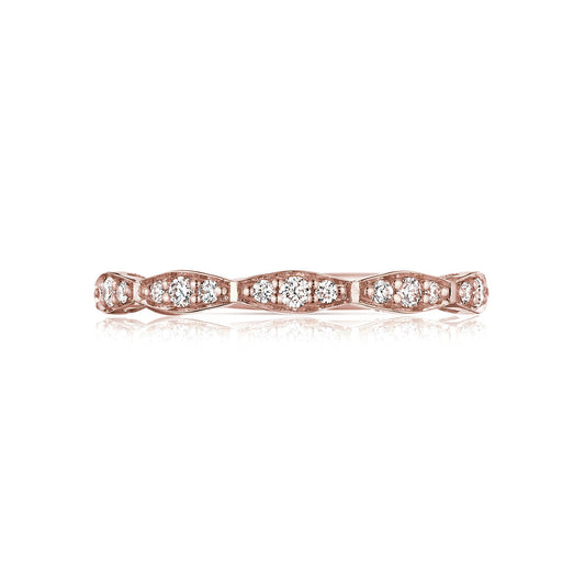 The Tacori Sculpted Crescent Marquise Design 18K Rose Gold Round Brilliant Diamond Anniversary Ring boasts a delicate rose gold band decorated with round-brilliant diamonds in an intricate vintage-inspired pattern. Crafted by Tacori gemologists, this ring features a wavy design that enhances its elegant and sophisticated appearance.