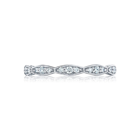 Discover the Tacori Sculpted Crescent Marquise Design Eternity Ring, an elegant piece crafted in 18K white gold and adorned with round brilliant diamonds. Its thin silver band showcases a reflective finish reminiscent of exquisite engagement rings, beautifully set against a white background.