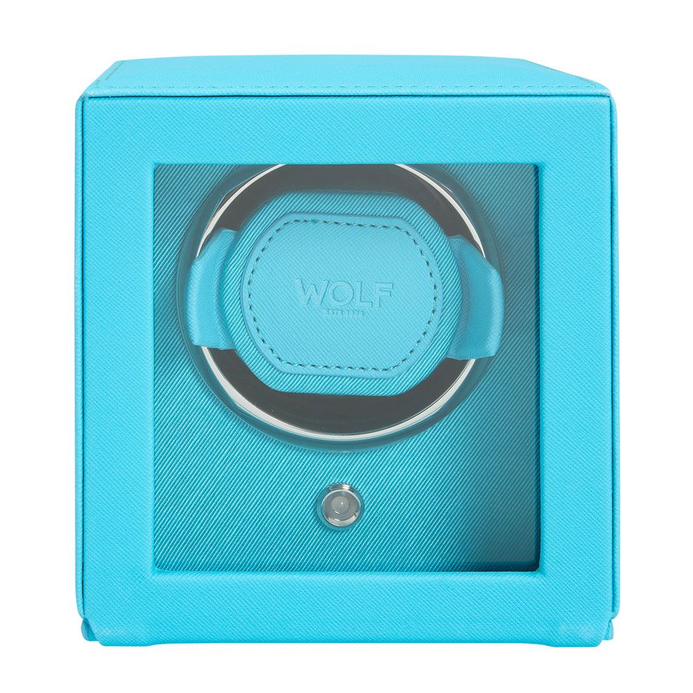 The WOLF 1834 Cub Single Watch Winder in turquoise vegan leather features a glass front, padded "WOLF" holder, patented rotation, and a small button beneath the holder.