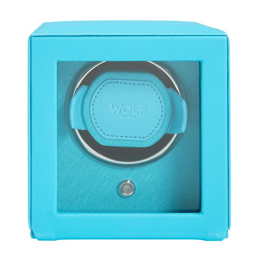 The WOLF 1834 Cub Single Watch Winder in turquoise vegan leather features a glass front, padded "WOLF" holder, patented rotation, and a small button beneath the holder.