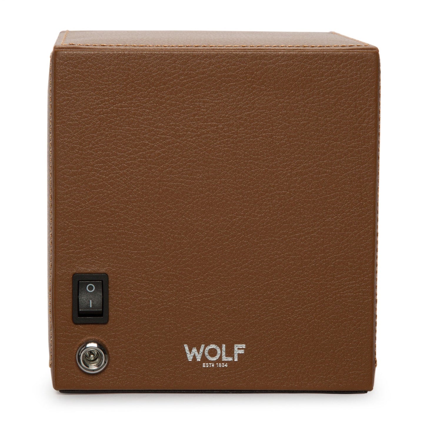 The WOLF 1834 Cub Single Watch Winder With Cover features a brown leather exterior with a sleek black on/off switch and a metallic knob on the side for customized rotation programs. The front is elegantly branded with "WOLF" in silver lettering, making it an ideal choice for showcasing your watches.