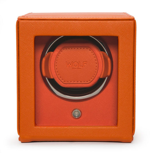 The WOLF 1834 Cub Single Watch Winder Orange is a square, orange vegan leather watch winder with a clear front window, a "WOLF" logo inside, patented rotation programs, circular watch holder, and a small button below the window.