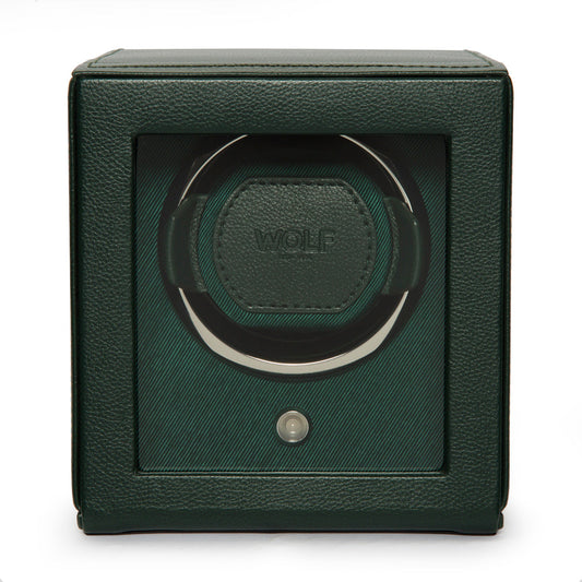 A WOLF 1834 Cub Winder With Cover in green, featuring a sleek, square design encased in textured vegan leather. The transparent front reveals the single winding module within, with the "WOLF" brand name prominently displayed to emphasize its elegance.