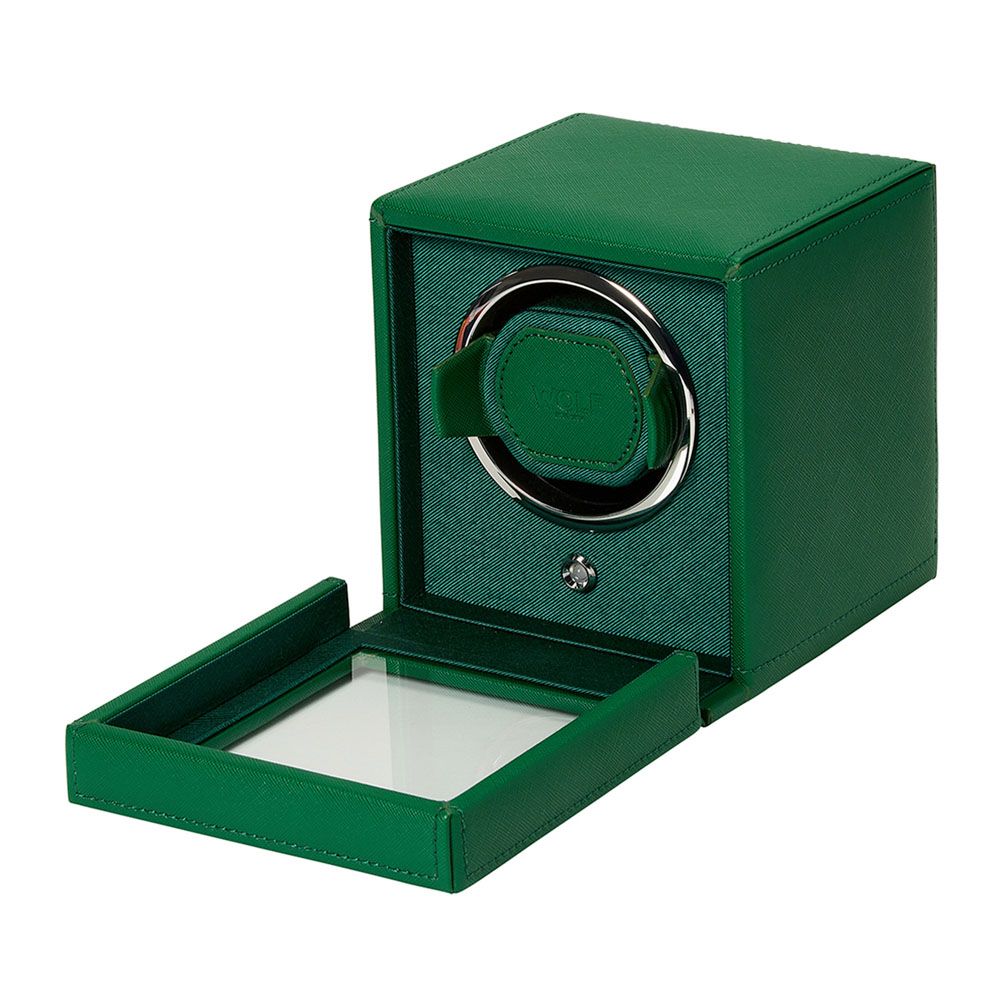 The WOLF 1834 Cub Single Watch Winder in green vegan leather features a glass hinged door and circular watch holder, accented with metallic detailing for a sleek, modern look. Brand: WOLF.