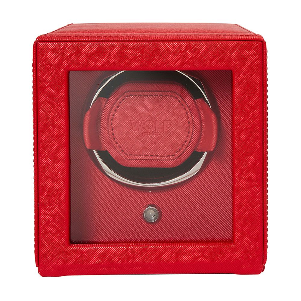 The WOLF 1834 Cub Single Watch Winder Red is a square, vegan leather winder with a transparent front. It offers rotation programs and has a circular holder that displays your watch, featuring the "WOLF" brand name.