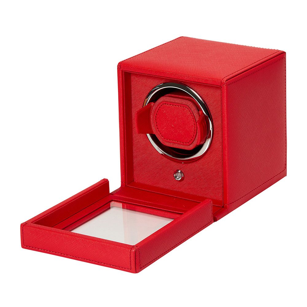 The WOLF 1834 Cub Single Watch Winder Red by WOLF features a red vegan leather, square design with an open front door revealing a circular holder for your watch, offering secure storage and customizable rotation programs.