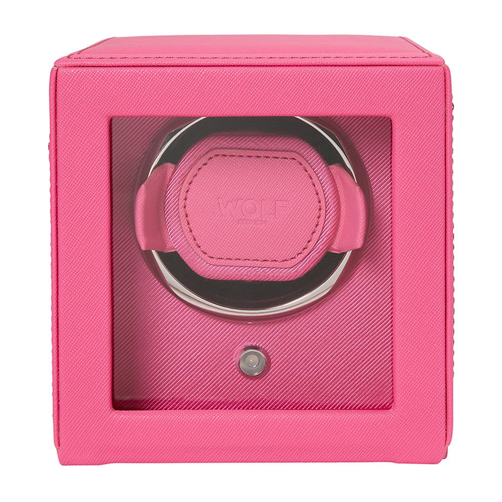 The WOLF 1834 Cub Single Watch Winder Pink features vegan leather, a clear front window, and a circular holder with WOLF's patented lock-in dynamic cuff to securely hold and wind your wristwatch.