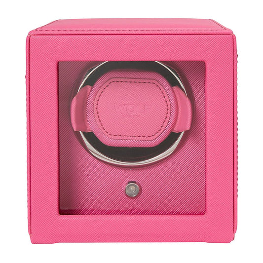 The WOLF 1834 Cub Single Watch Winder Pink features vegan leather, a clear front window, and a circular holder with WOLF's patented lock-in dynamic cuff to securely hold and wind your wristwatch.