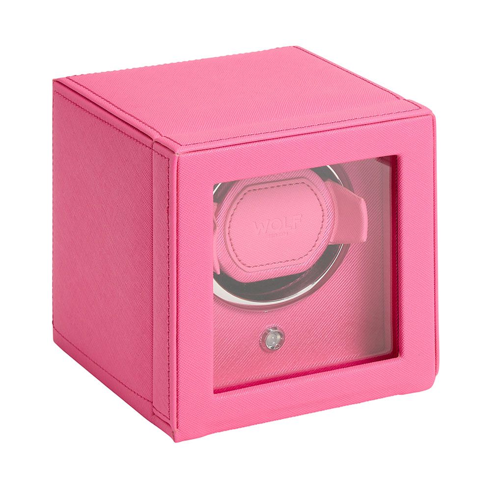 The WOLF 1834 Cub Single Watch Winder Pink is a cube-shaped, vegan leather winder with a glass front and patented lock-in dynamic cuff to securely hold your watch.