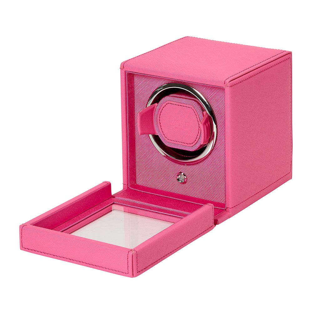 The WOLF 1834 Cub Single Watch Winder in bright pink vegan leather features a glass-fronted door, revealing the circular watch holder and patented lock-in dynamic cuff inside. Brand: WOLF.