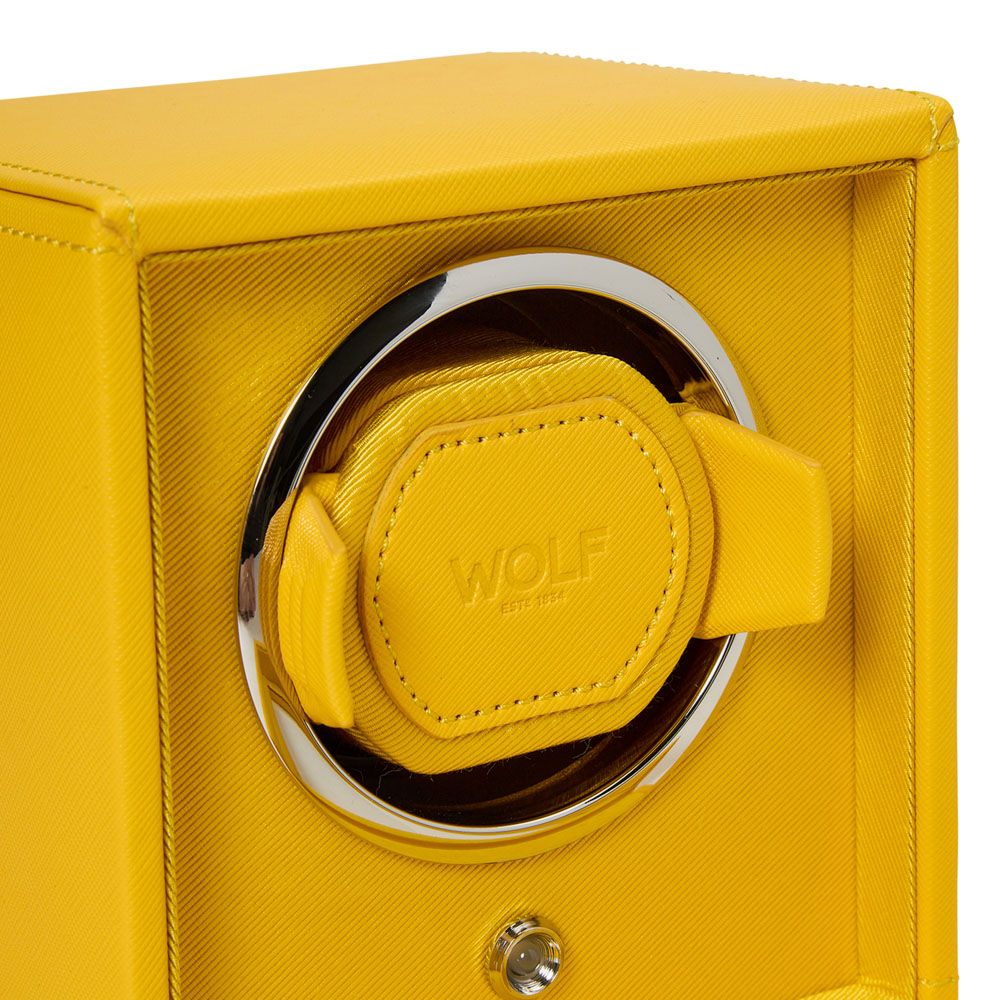 Close-up of the WOLF 1834 Cub Single Watch Winder in yellow, featuring a chrome-trimmed circular holder, textured vegan leather finish, and embossed "WOLF" branding inside. Showcases patented rotation programs.