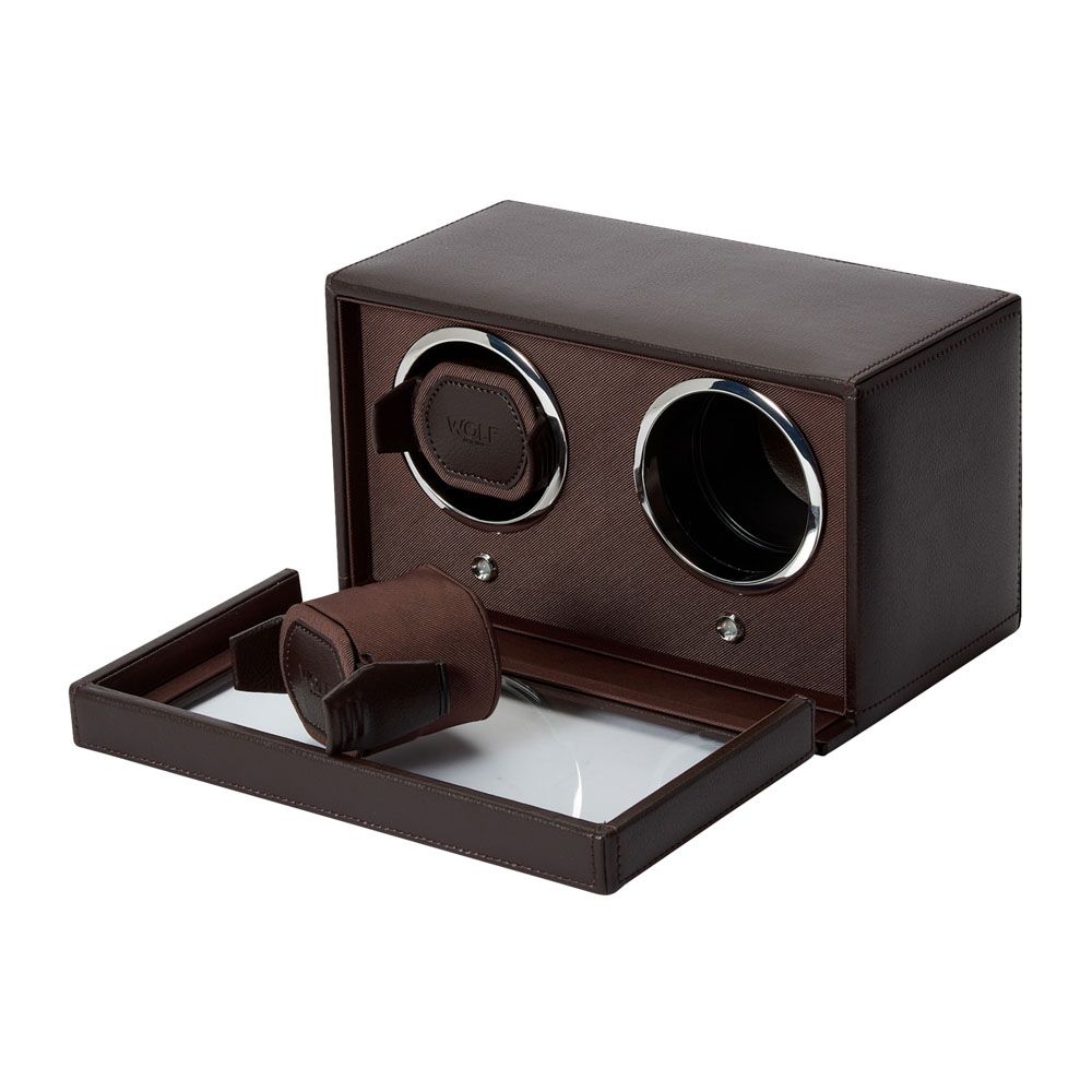 Presenting the WOLF 1834 Cub Double Winder With Cover in Brown—a refined vegan leather watch winder box from WOLF, featuring two circular slots (one with a watch holder), plus a sliding drawer revealing an additional watch holder. Ideal for safeguarding your treasured timepieces and ensuring they’re always ready to wear, thanks to fully customizable rotation programs.