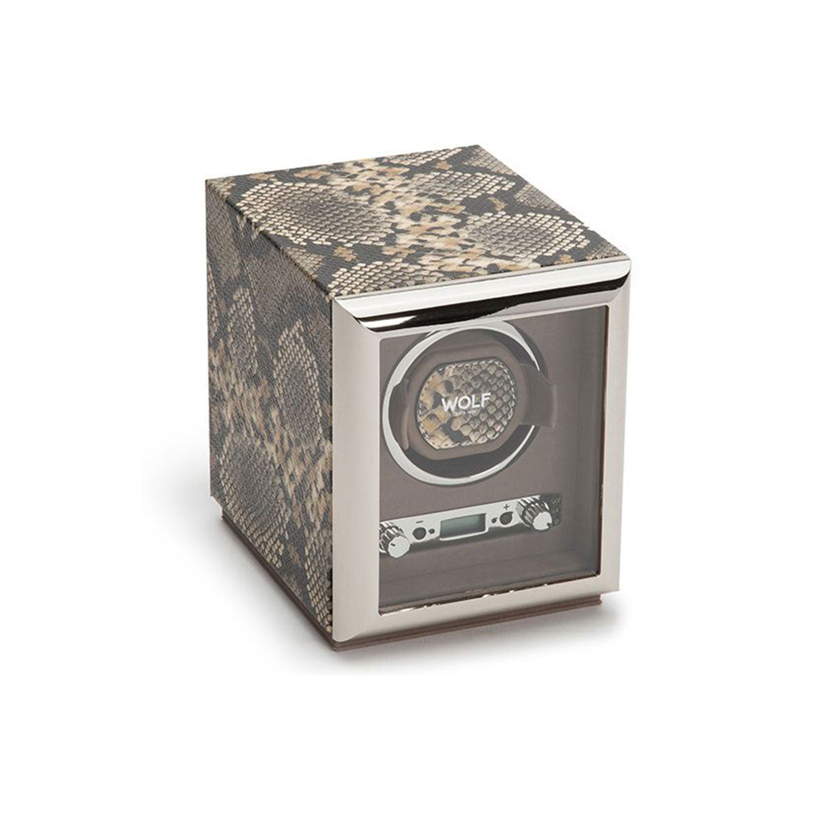 The WOLF 1834 Exotic Single Watch Winder boasts a sleek top grain cowhide leather exterior with a transparent front. It securely holds a watch from the renowned brand "WOLF," and its silver trim along with bottom controls ensure precise rotations, blending functionality with style.