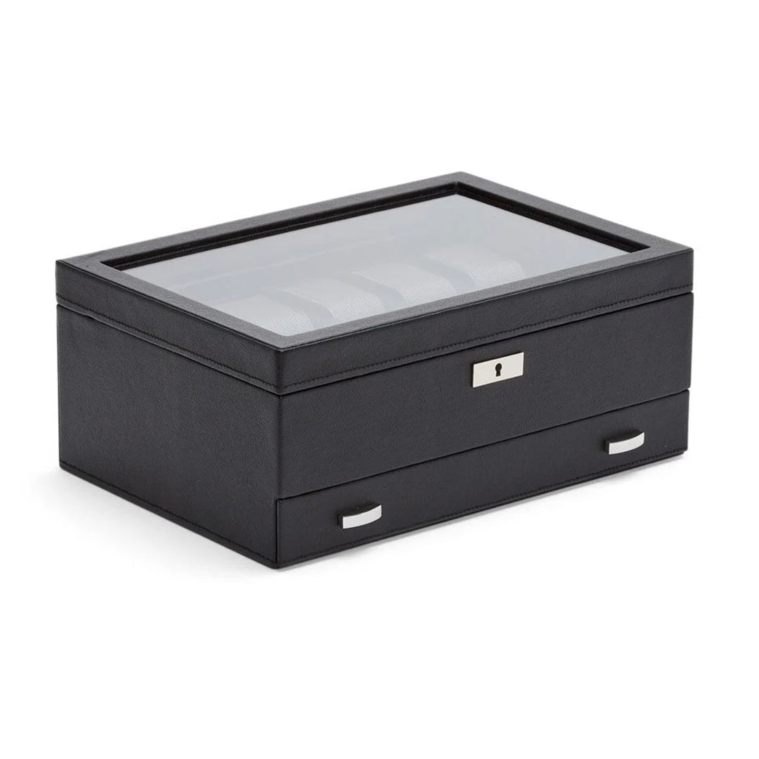 The WOLF 1834 Viceroy 10 Piece Watch Box with Drawer by WOLF is a stylish watch storage solution crafted from black vegan leather. It features a transparent glass lid to showcase multiple compartments and includes a secure front lock. Additionally, it has a bottom drawer with two metallic handles, combining both style and organization.