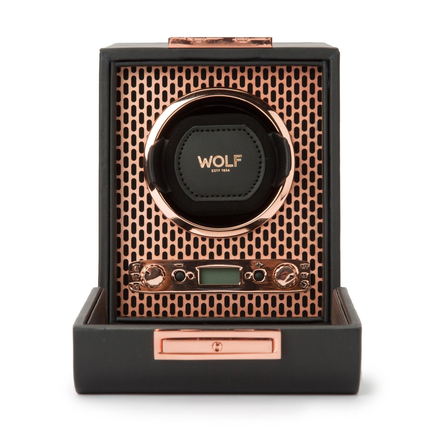 The WOLF 1834 Axis Single Watch Winder showcases a luxurious design with a copper and black color scheme, featuring a perforated metal face, control knobs for selecting rotation options, and a small digital display. The brand name "WOLF" is prominently visible on the central watch holder.