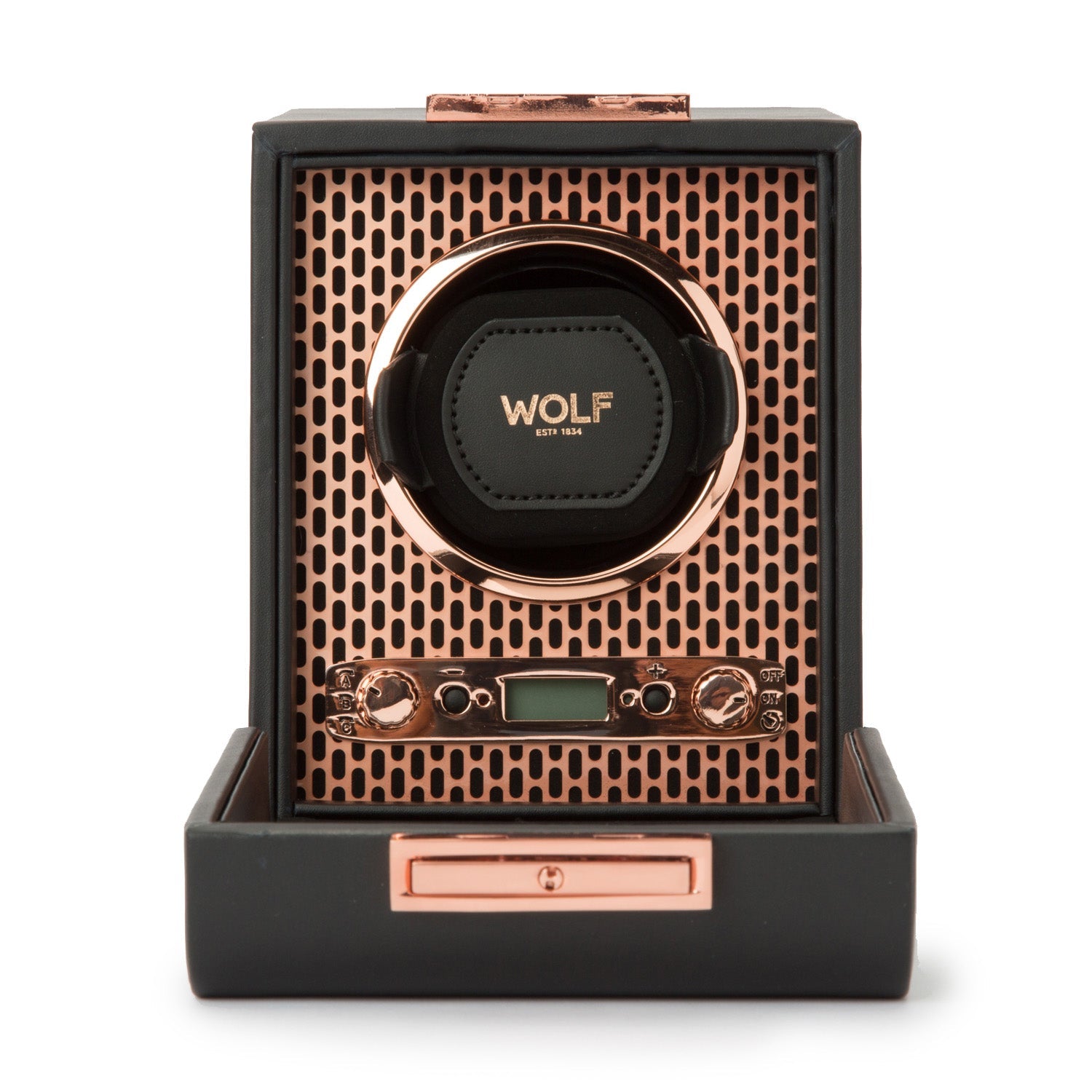 The WOLF 1834 Axis Single Watch Winder showcases a luxurious design with a copper and black color scheme, featuring a perforated metal face, control knobs for selecting rotation options, and a small digital display. The brand name "WOLF" is prominently visible on the central watch holder.