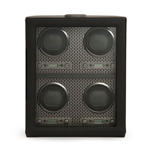 The WOLF 1834 Axis 4 Piece Winder showcases a sleek black design with four circular watch holders featuring a mesh pattern and a digital display underneath. Each holder prominently displays the "WOLF" brand, making it ideal for storing timepieces. With its minimalist lines and various rotation options, it ensures optimal watch maintenance.