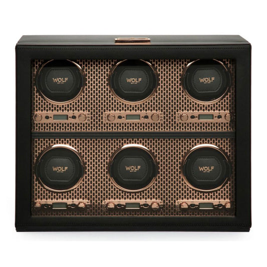 The WOLF 1834 Axis 6 Piece Winder, by WOLF, boasts a luxurious design with a black and copper finish, featuring six compartments arranged in two rows of three, each elegantly designed to hold a single timepiece.