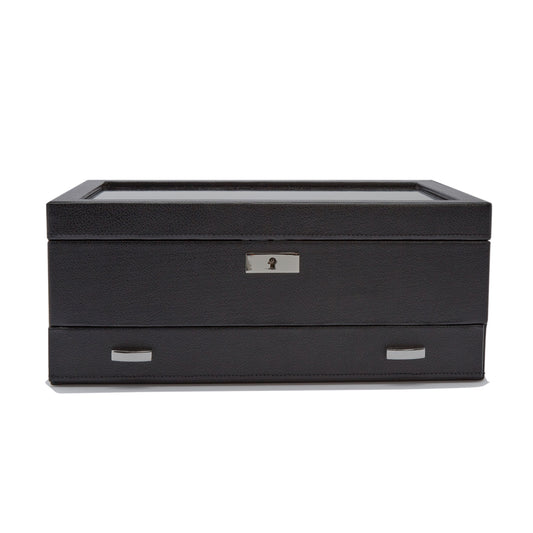 Introducing the WOLF 1834 Roadster 10 Piece Watch Box With Drawer by WOLF: crafted from black vegan leather, this elegant watch box features a glass top and comes equipped with lock and key security at the front. It showcases a sleek design enhanced by two metal handles on the bottom drawer, making it an ideal choice for watch storage.