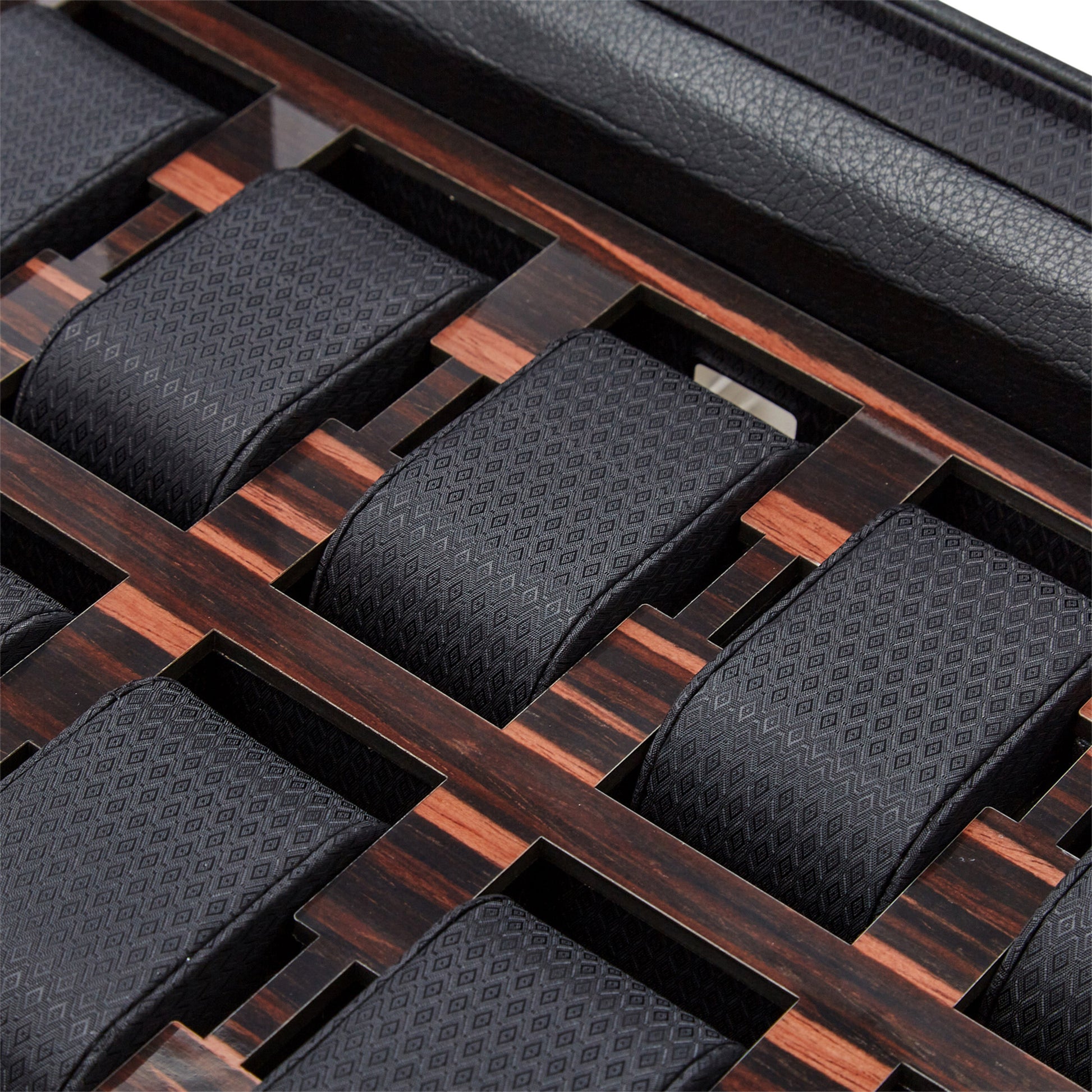 A neatly organized selection of elegant watches, presented in the WOLF 1834 Roadster 10 Piece Watch Box With Drawer. The box features a wooden grid-like design with vegan leather accents, providing each watch with its own individual compartment for an elegant and sophisticated storage solution.