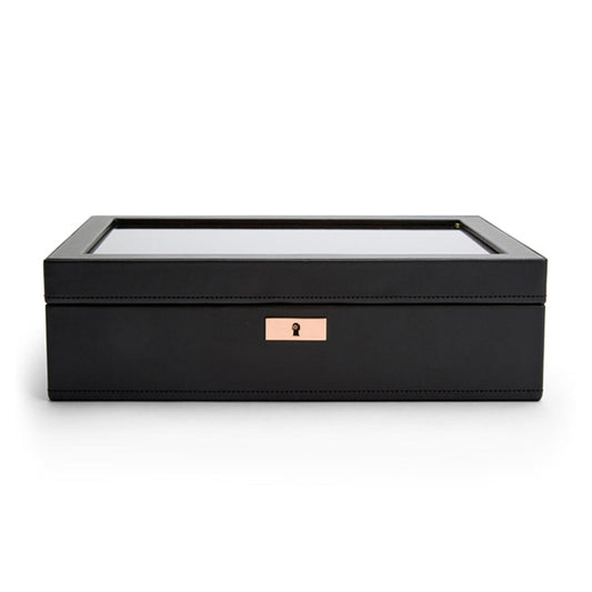 The WOLF 1834 Axis 10 Piece Watch Box by WOLF is a sleek, rectangular black jewelry box designed with lock and key security. It features a transparent glass lid and a subtle golden lock on the front. Inside, suspended watch cushions offer impeccable storage for watches.