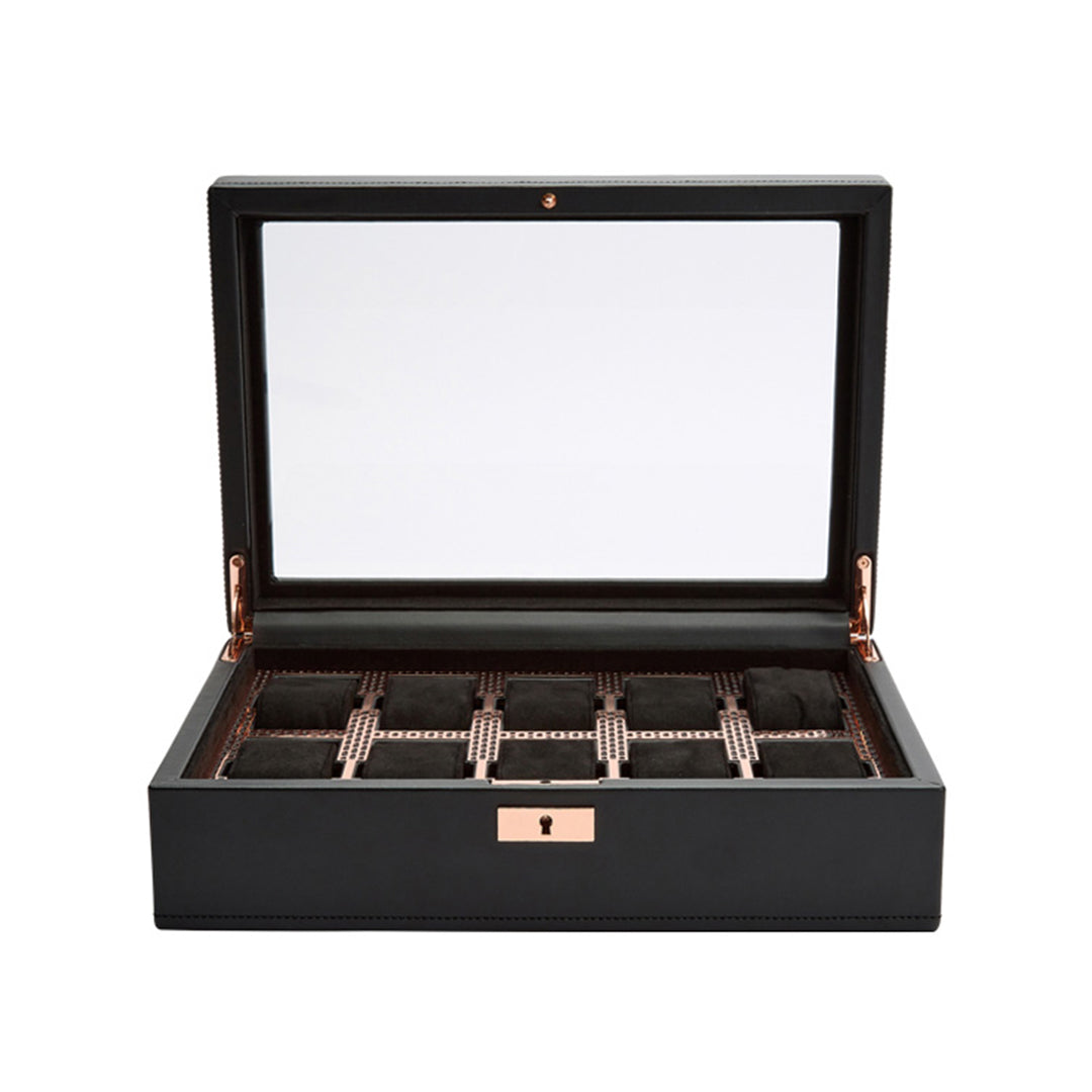 The WOLF 1834 Axis 10 Piece Watch Box by WOLF is open, showcasing several compartments lined with dark fabric and suspended watch cushions, ideal for smart watch storage. The black leather box has a glass lid with rose gold accents and includes a keyhole on the front.