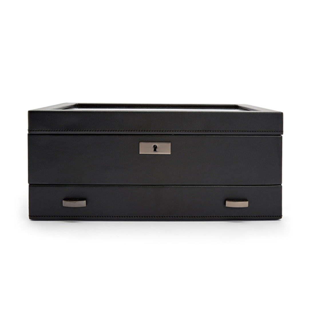 The WOLF 1834 Axis 10 Piece Watch Box with Drawer, by WOLF, features a sleek black design with metallic handles and a front lock. Its smooth surface and contemporary style make it ideal for storing watches or other valuables, combining elegance with security.