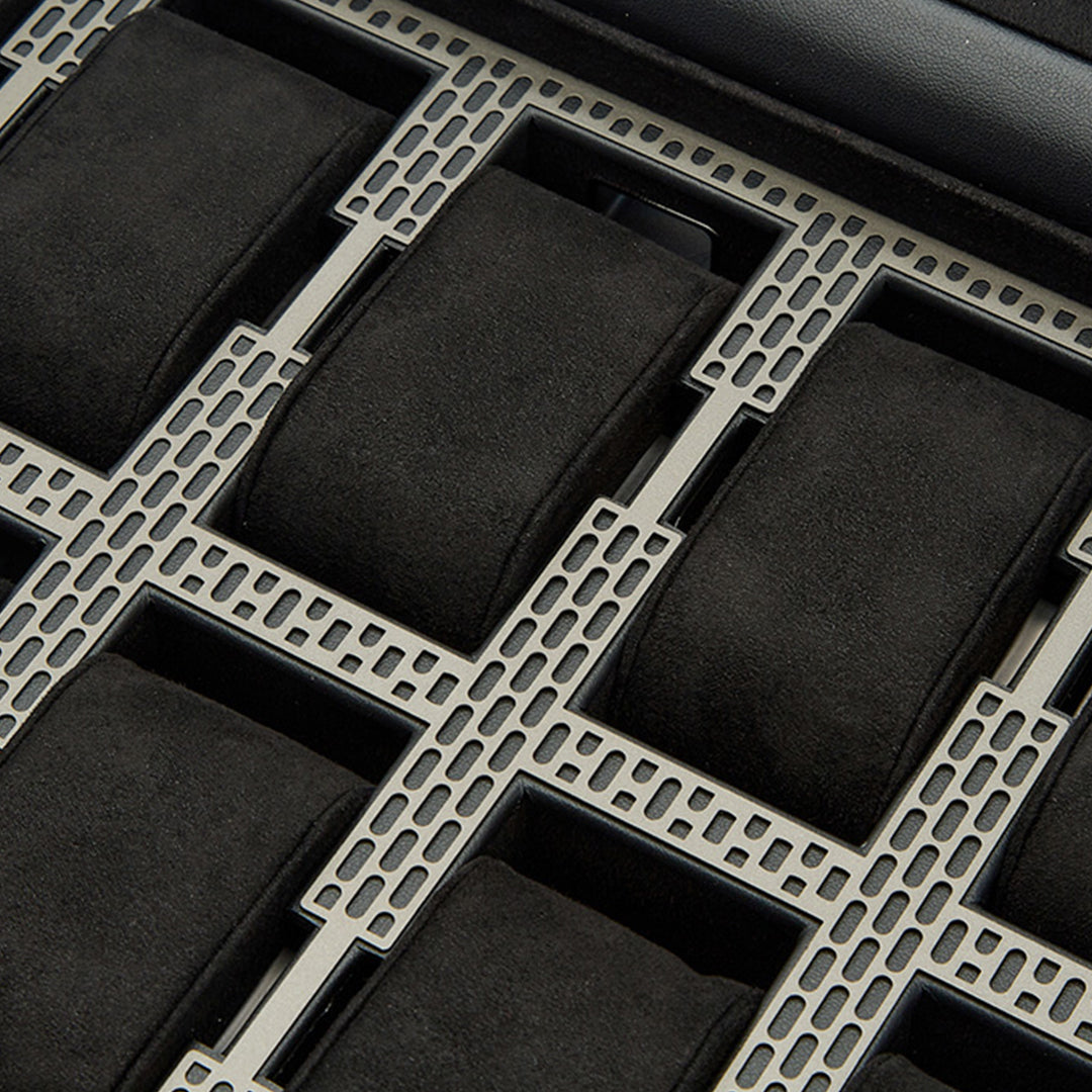Detailed view of the WOLF 1834 Axis 10 Piece Watch Box with Drawer, showcasing its slots lined with soft, dark material to securely accommodate watches. The structured design includes metallic dividers and an advanced lock and key system by WOLF to safeguard your watch collection.