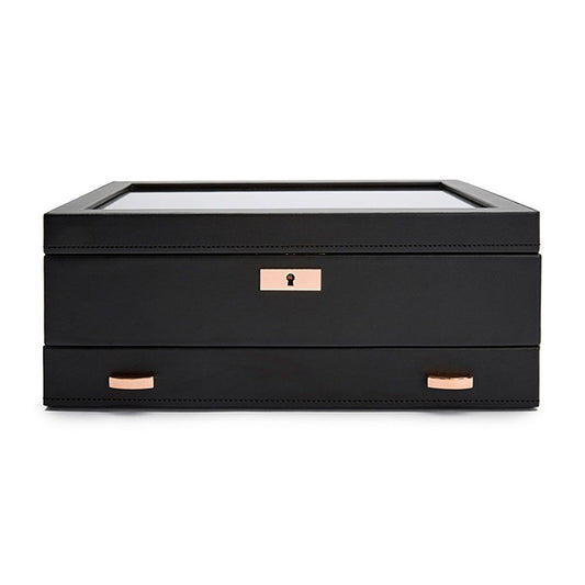 The WOLF 1834 Axis 10 Piece Watch Box With Drawer by WOLF is a sleek black rectangular case featuring a glass top, rose gold-tone lock and key for security, a smart watch USB port, and two matching handles on the lower drawer—ideal for elegant watch storage.